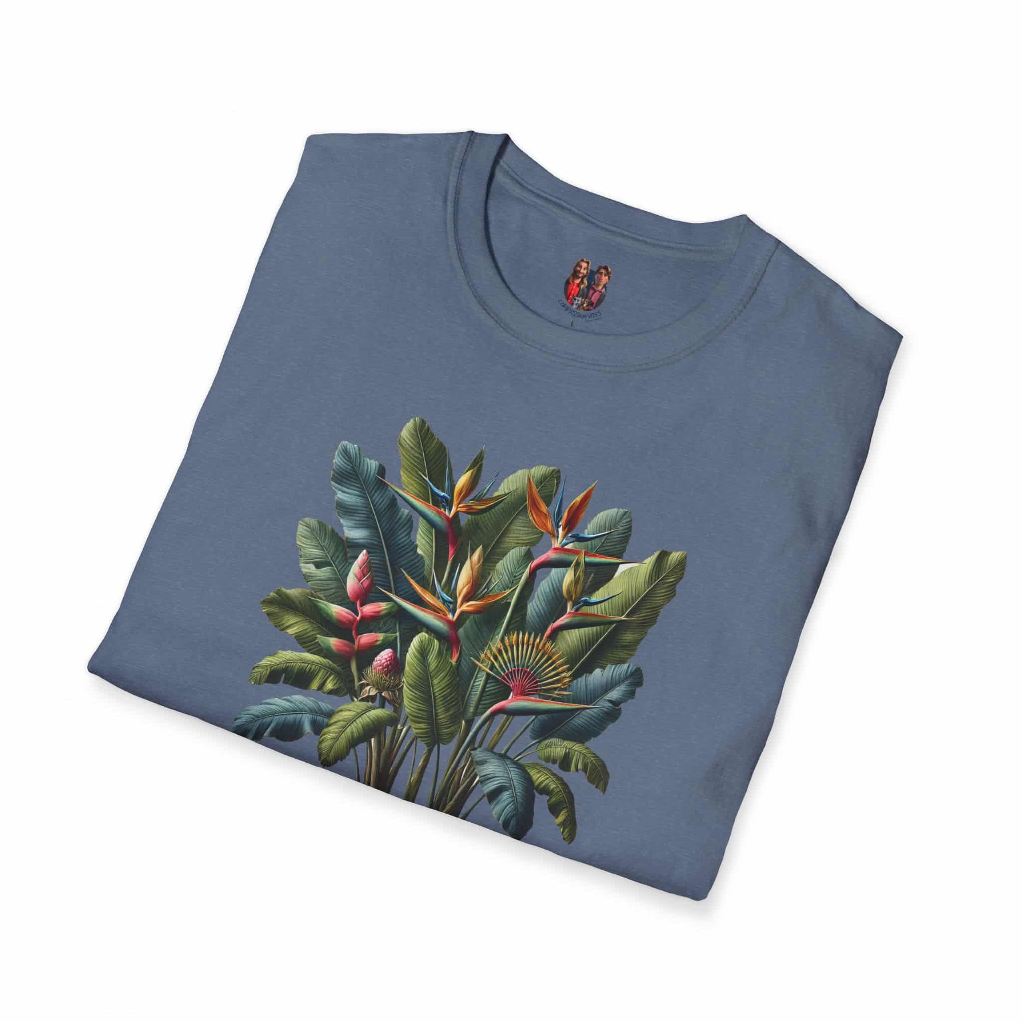 Blue T-shirt featuring a vibrant tropical plant design with leaves and flowers.