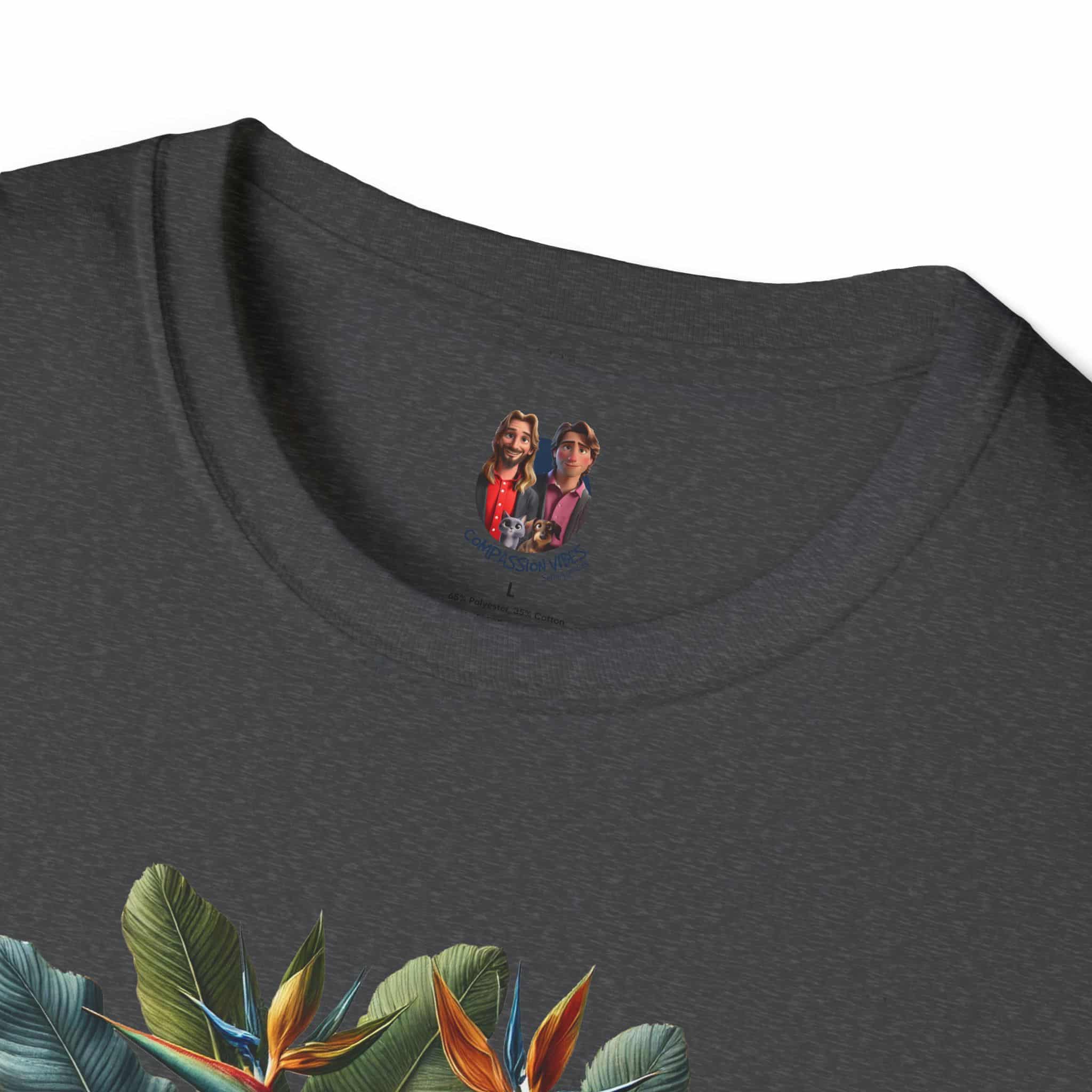Gray T-shirt featuring a tropical design with leaves and flowers, along with two cartoon characters in the neckline area.