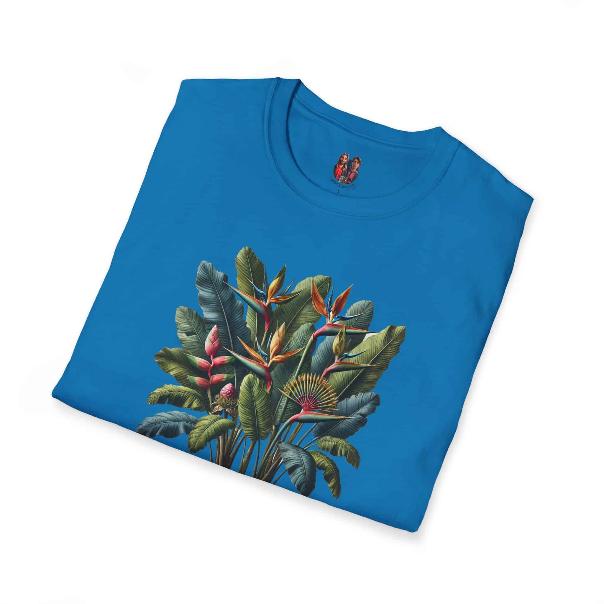 Blue T-shirt featuring a tropical plant design with various leaves and flowers.