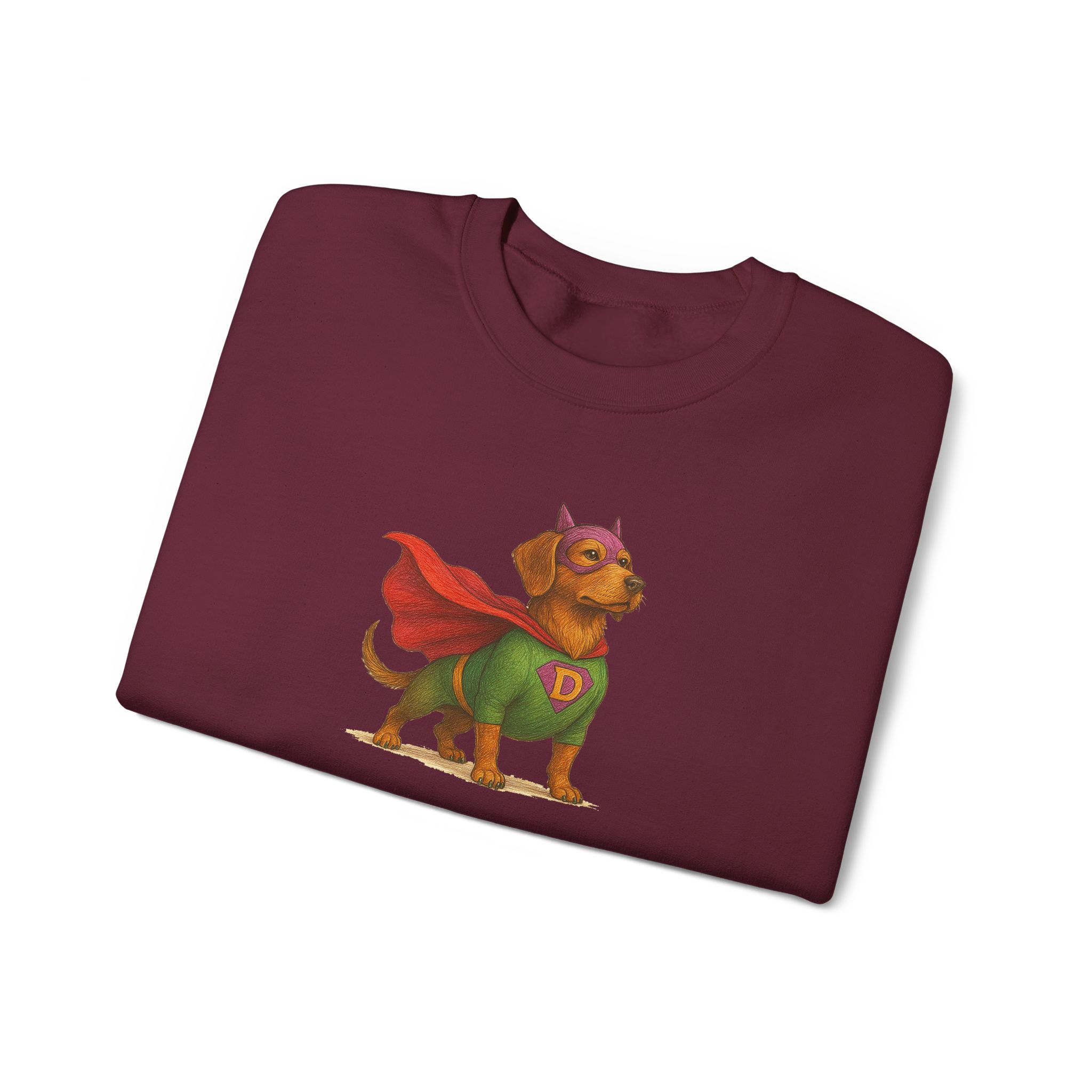 Maroon t-shirt featuring a dog in a superhero costume with a green outfit and red cape.